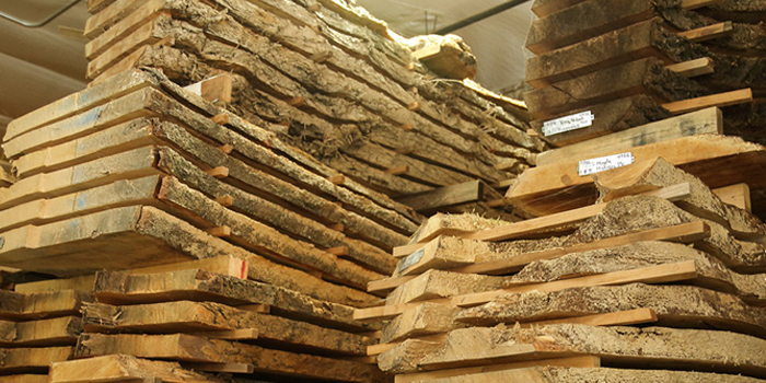 Milled slabs of recovered wood air drying at the warehouse of Urban Hardwoods.
