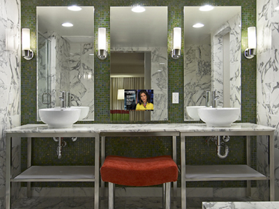 Three Loft Bathroom Mirrors with one equipped with a TV at a Flamingo Hotel super suite in Las Vegas, Nevada.